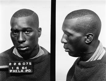 (AMERICAN CRIME) Thick white binder containing 400 mug shots of men and women who were picked up in Philadelphia for a range of petty c